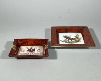 (2pc) HOLLAND & BERETTA Vintage Ashtrays | Both have brown trim with gold accents. One is by Holland and Holland and the other has a picture of a stag in the center. Both marked on back. - w. 9 x l. 9 in