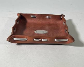 Leather Tray | Leather tray with metal weaved through rim. Fisherman’s fly medallion in middle. Marked Col Littleton on back. - w. 7 x l. 7 in