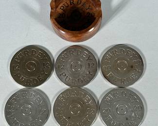 Purdey & Sons London Shotgun Maker Drinks Coasters | A set of six metal 12 Gauge shotgun shape metal coasters housed in a burl walnut holder - h. 2 x w. 4 in