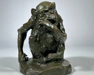 After Georges Lucien Guyot | Singe à la Banane | Monkey eating a banana a composite painted to look bronze. Signed Guyot 1907. - h. 11 x l. 10 x d. 9 in