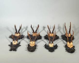 (8pc) Antique Hunting Trophies | Carved Black Forest German wall hangings/awards adorned with oak leaf motifs and acorns. Inscriptions of winners’ names and dates. Dates range from 1897 to 1934. - h. 14 x l. 8 in (Largest)