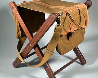 Foldable Sand & Storm Leather & Canvas Camp Bench | Made of leather, canvas and wood. Includes adjustable strap and a bag on each side. Folds for easy carry. - h. 21 x l. 17 x d. 17 in (Opened)
