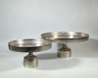(2pc) PAIR AERO NYC PEDESTAL TRAYS | Pair of cast aluminum pedestal trays, marked on bottom Aero NYC - h. 10.75 x dia. 23 in (larger)