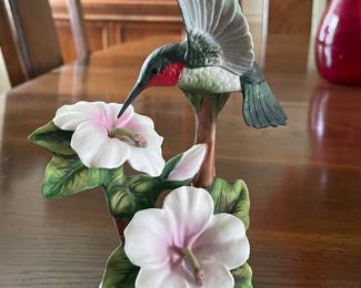 Porcelain hummingbird on flower