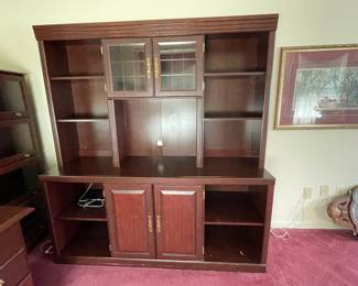 Office hutch with desk space. Cabinet space with pullout drawers. 