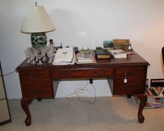 Desk, books, lamp.
