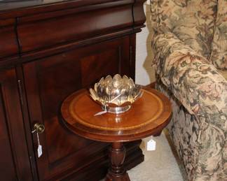 Side table from Rike-Kumler, with leather top and original store tag to bottom.