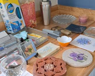Lots of trivets; cocktail shaker, cutting boards, etc., many vintage