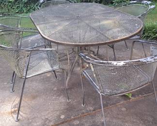 Outdoor dining set, wrought iron. Oval shape, 4 arm chairs