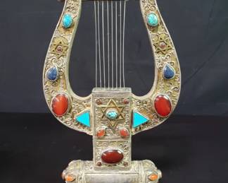 Sterling silver King David's hard adorned with garnet, lapis, and turquoise gemstones