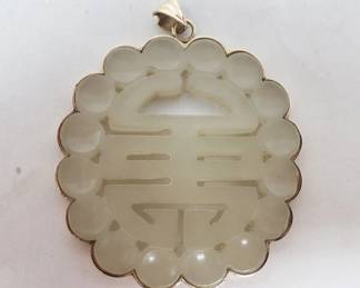 14k gold Asian style stone pendant