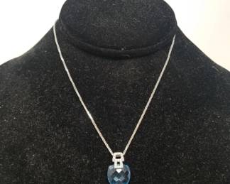 14k white gold necklace with diamond and blue topaz pendant
