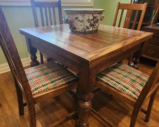 English drawleaf pub table with barley twist chairs.