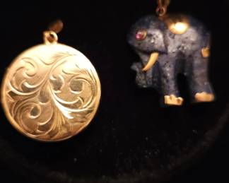 14kt y/g locket and 14k & lapis elephant