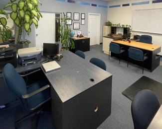 desk, chairs, lamps, whiteboard, cabinets, printers, computers