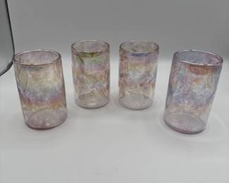 Set of 4 iridescent glass tumblers. Unique design featuring a beautiful color gradient. Perfect for collectors or as a stylish addition to your drinkware.