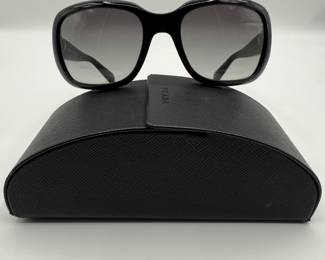 Iconic Prada Sunglasses. These are the sunglasses that Prada is known for! Black sunglasses with the Prada logo and gradient lenses. Original case still available.