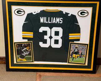 Framed autographed jersey from Green Bay Packers player Tramon Williams #38, complete with two framed action photos of the player. See pictures for more details.