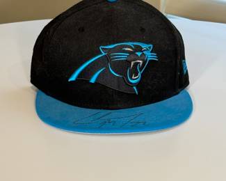 This is an official NFL hat that has been signed by Christian McCaffrey #22 during his time with the Carolina Panthers.