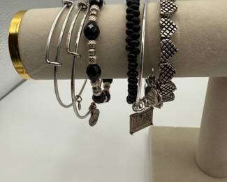 Alex and Ani stack of bracelets featuring a mix of adjustable and wrap. Ornate heart wrap, February charm, beaded bracelets. Includes various styles and materials. See pictures for more details.