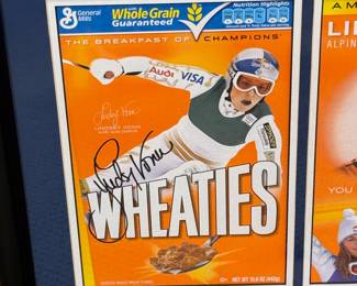 This is a Wheaties collectors box signed by professional skier Lindsey Vonn. 
