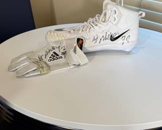 Harrison Phillips of the Minnesota Vikings #99 - Game cleat and glove. Ready for any football fan to add to their collection!
