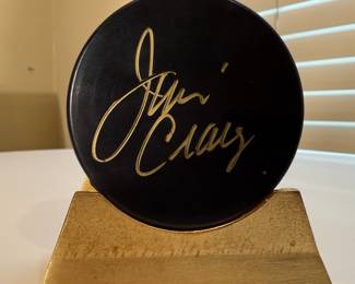 This is a collection of autographed hockey pucks including the special 1980 US Olympic Team know for having won against Russia, signed by Jim Craig. 
