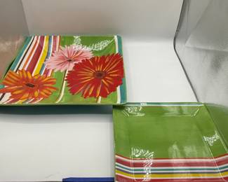Colorful Decorative Plates - Set of 2. Featuring bold Gerber daisy floral designs and vibrant striped patterns. Perfect for home decor or entertaining.