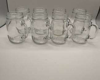 Set of 8 Vintage Glass Mason Jars with Handles. Perfect for home decor or serving drinks. See pictures for more details.