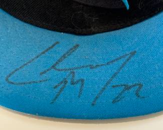 This is an official NFL hat that has been signed by Christian McCaffrey #22 during his time with the Carolina Panthers.