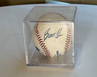 The ball has a blue signature that reads 'Bruce Chen' from his time with the Kansas City Royals. It is enclosed in a clear, square acrylic display case.
