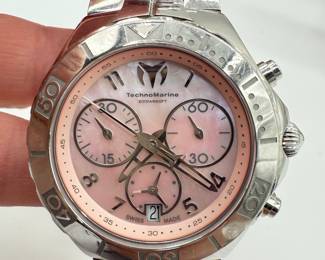 TechnoMarine Women's Chronograph Watch with a pink mother of pearl and stainless steel band. Battery recently replaced, appears to be working, future mechanical state not guaranteed. See pictures for details.