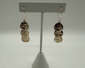 Beautiful Mexican Sterling 925 earrings featuring three hammered discs. Perfect for adding a touch of elegance to any outfit. .203ozt