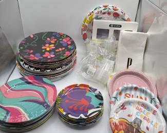 Lot of assorted decorative paper plates featuring vibrant floral and abstract designs. Includes various sizes and styles. Perfect for parties and events.