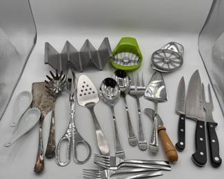 A diverse collection of kitchen utensils and cutlery, including forks, knives, spatulas, and more. Ideal for cooking enthusiasts or anyone looking to enhance their kitchen tools