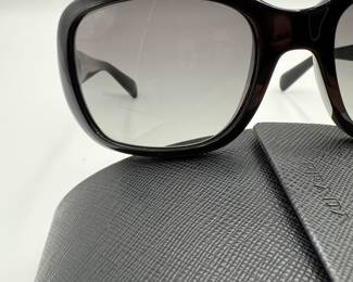 Iconic Prada Sunglasses. These are the sunglasses that Prada is known for! Black sunglasses with the Prada logo and gradient lenses. Original case still available.