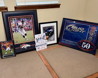 Denver Broncos Memorabilia Lot featuring a signed photo, framed artwork, and various collectible items. See pictures for more details.