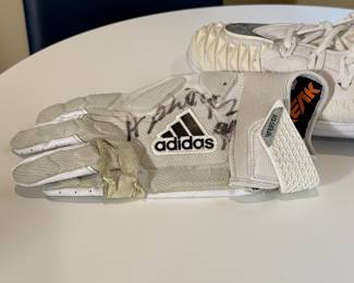 Harrison Phillips of the Minnesota Vikings #99 - Game cleat and glove. Ready for any football fan to add to their collection!
