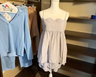Free People two piece set in a subtle lavender cotton. Cami tank with matching shorts. The collection also includes two athletic leisure sets, one in a tan color, one in a clear baby blue. 