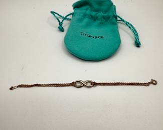 Tiffany & Co. Infinity Bracelet in 925 sterling silver. Comes with original teal pouch. Apx. 6 1/2" long.