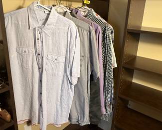 Lot includes several men's dress shirts in various styles and colors. Gently used condition. See pictures for more details