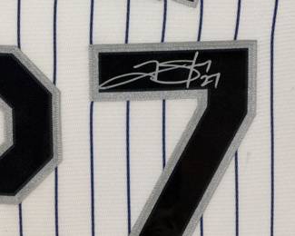 Framed signed jersey of Trevor Story, #27, with accompanying photographs. Features a Colorado Rockies theme. See pictures for more details.