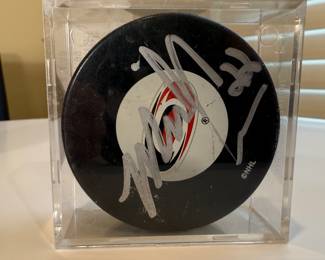 This is a collection of autographed hockey pucks including the special 1980 US Olympic Team know for having won against Russia, signed by Jim Craig. 