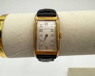 An Original Hamilton Gold Tone Rectangle Watch with Black Leather Strap. Battery recently replaced. Not tested. Future mechanical state not guaranteed. See pictures for more details.