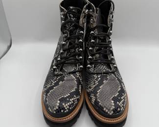 A pair of iconic Marc Fisher ankle boots with a snakeskin pattern featuring shades of gray and black, adorned with metallic eyelets and laces. The boots have a chunky sole with a rugged tread. The second pair is from Anthropologie and made from shiny leather, featuring a rounded toe and traditional laces. The dress shoes have a thick black sole with a slightly elevated platform design.