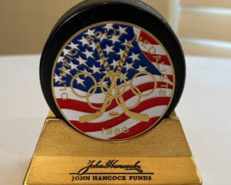 This is a collection of autographed hockey pucks including the special 1980 US Olympic Team know for having won against Russia, signed by Jim Craig. 