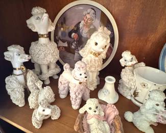 Collection of Vintage Ceramic Poodle Figurines in Various Poses and Styles