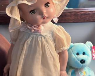 Antique porcelain doll with stand