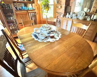 Vintage Oak Dining Room with Brick Accents and Antique Decor