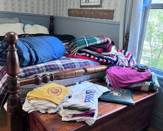 Room full of menswear, blankets, and other treasures 